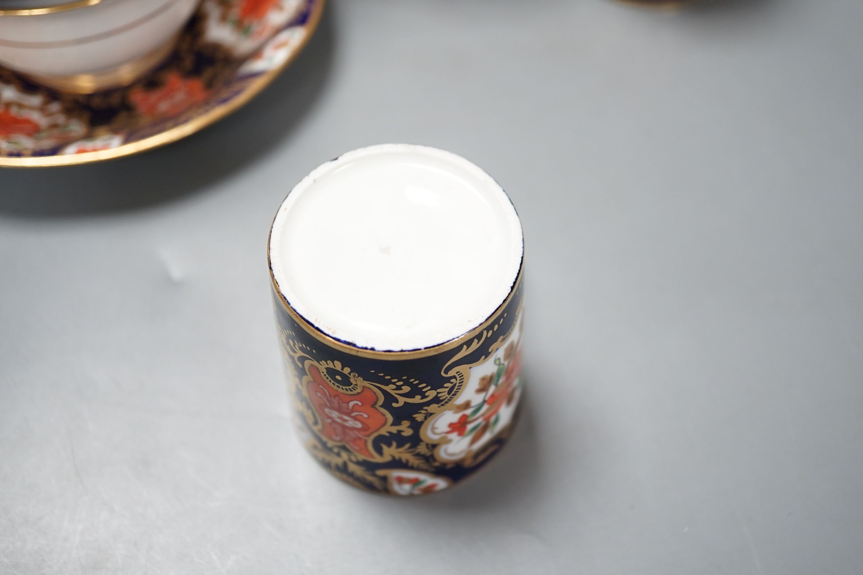 A mid 19th century English bone china fifty-two piece part tea and coffee service, decorated in an Imari pattern